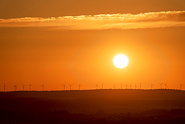 Wind turbines standing on a hill at sunrise, Timmenrode, Saxony-Anhalt, Germany, Europe