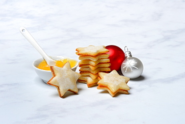 Lemon cookies and bowl with lemon curd, Christmas tree balls, Germany, Europe