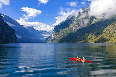 Red kayak in Geirangerfjord, near Geiranger, More og Romsdal, Norway, Europe