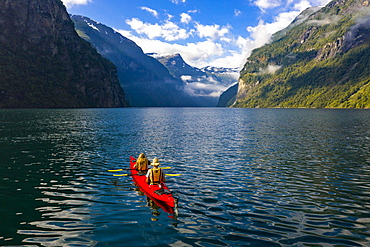 Red kayak in Geirangerfjord, near Geiranger, More og Romsdal, Norway, Europe