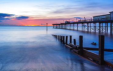 Sunrise in long time exposure of Grand Pier, Teignmouth, Devon, England, Great Britain