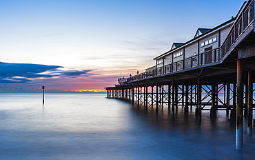 Sunrise in long time exposure of Grand Pier, Teignmouth, Devon, England, United Kingdom, Europe