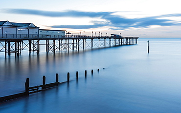 Sunrise in long time exposure of Grand Pier, Teignmouth, Devon, England, United Kingdom, Europe