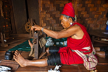 Old Kayan women weaving the traditional way, Kayah village, Loikaw area, Kayah state, Myanmar, Asia