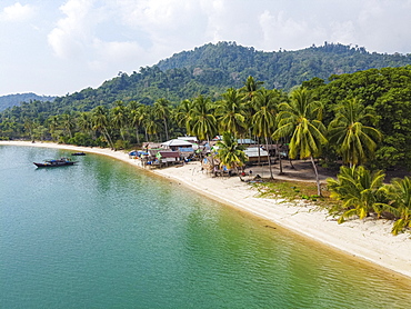 Aerial of a Moken, sea gypsy village on a white sand beach, Mergui or Myeik Archipelago, Myanmar, Asia