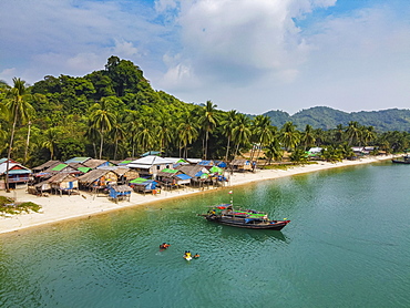 Aerial of a Moken, sea gypsy village on a white sand beach, Mergui or Myeik Archipelago, Myanmar, Asia