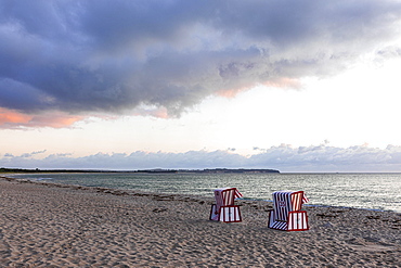 Lonely beach chairs in the morning light at the big beach of Thiessow, island Ruegen, Baltic Sea, Mecklenburg-Western Pomerania, East Germany