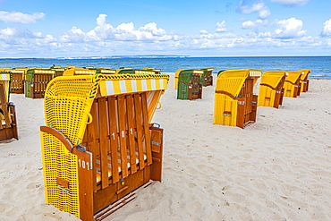 Closed beach chairs at the beach of the seaside resort Binz, island Ruegen, Baltic Sea, Mecklenburg-Western Pomerania, East Germany