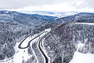 Winter snow road serpentine curves aerial photo near Albstadt curve, Germany, Europe