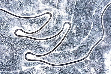 Road serpentines winter snow curves Lochenpass forest aerial photo curve, Germany, Europe