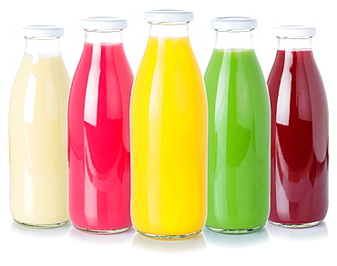 Various juices fruit juice drinks drink juice glass bottle cropped cutout isolated against a white background