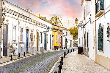 Traditional old Portuguese houses in old town of Faro by sunset, Algarve, Portugal, Europe