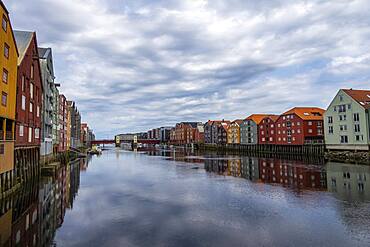 Colourful historic warehouses by the river Nidelva, Trondheim, Trondelag, Norway, Europe