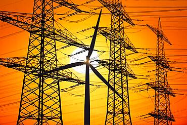 Overhead lines, wind turbine, sunset, Baden-Wuerttemberg, Germany, Europe