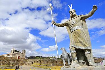 Statue of the Inca Pachacutec in front of sun temple with attached cathedral from the colonial period, Vilcashuaman, Ayacucho region, Peru, South America