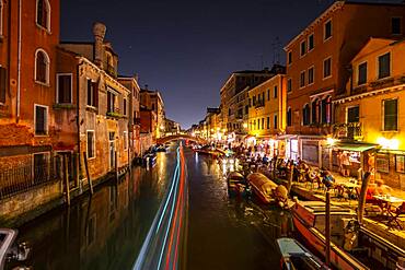 Canal with boats and historical buildings, light traces, Venice, Veneto, Italy, Europe