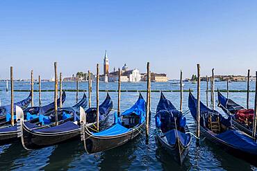 Venetian gondolas, behind church San Giorgio Maggiore, Venice, Veneto, Italy, Europe