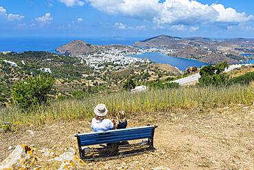 Woman and her daughter at a overlook over Patmos an the town of Skala, Patmos, Greece, Europe