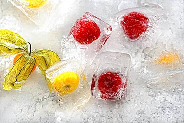 Raspberries frozen in ice cube cubes