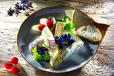 Cheese platter, various cheeses served with grapes