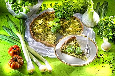 Vegetable quiche, green vegetable cake with zucchini, sliced