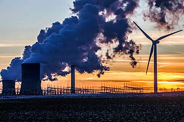 Wind turbine in front of steaming coal-fired power plant at sunset, energy transition, fossil and renewable energy, Niederaussem, North Rhine-Westphalia, Germany, Europe