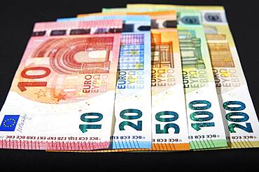 Various euro banknotes on black background, Germany, Europe