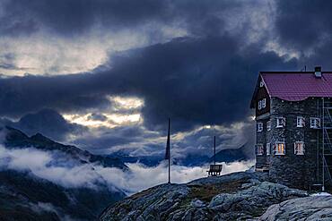 Siegerlandhuette at blue hour with dramatic cloudy sky, Soelden, Oetztal, Tyrol, Austria, Europe