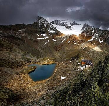 Hildesheimer Hut with Oetztal mountains and dramatic sky, Soelden, Oetztal, Tyrol, Austria, Europe