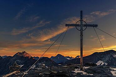 Sunrise over summit of high Nebelkogel with summit cross, Soelden, Oetztal, Tyrol, Austria, Europe