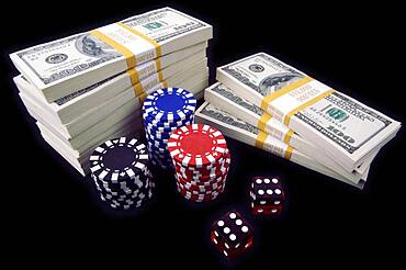 Stack of ten thousand dollar piles of one hundred dollar bills, red dice & poker chips on a black background