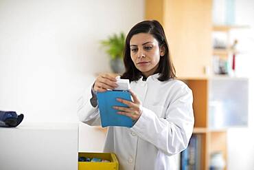 Pharmacist working with medicine in a pharmacy, Germany, Europe