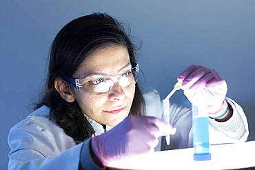 Middle aged technician in laboratory with lab coat, Freiburg, Baden-Wuerttemberg, Germany, Europe