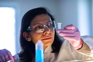 Middle aged technician in laboratory with lab coat, Freiburg, Baden-Wuerttemberg, Germany, Europe