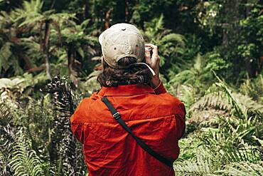 Guy with camera, Redwoods Forest, Whakarewarewa, North Island, New Zealand, Oceania