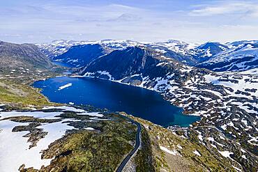 Aerial of a mountain lake in the mountains over Geirangerfjord, Sunmore, Norway, Europe