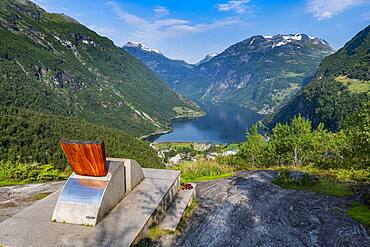 Design chair on a overlook over Geirangerfjord, Sunmore, Norway, Europe