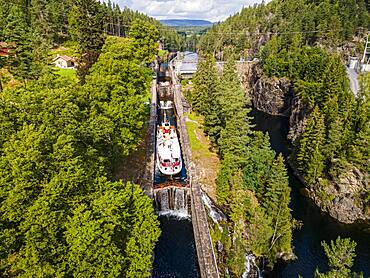 Aerial of a tourist boat in the Vrangfoss lock, Telemark Canal, Norway, Europe