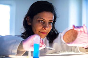 Middle aged technician in lab with lab coat, Freiburg, BW