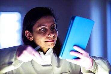 Middle aged technician in lab with lab coat, Freiburg, BW