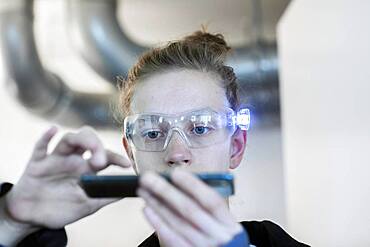 Young logistician working with scan glasses, Freiburg, Baden-Wuerttemberg, Germany, Europe