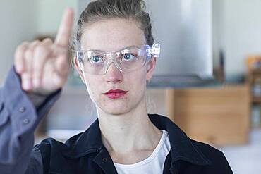 Young logistician working with scan glasses, Freiburg, Baden-Wuerttemberg, Germany, Europe