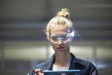 Young logistician working with scan glasses, Freiburg, Baden-Wuerttemberg, Germany, Europe