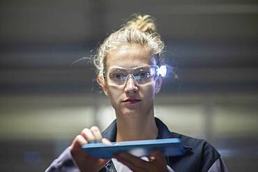 Young logistician working with scan glasses, Freiburg, Baden-Wuerttemberg, Germany, Europe