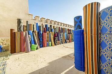 Many rolls of plastic carpet sold on Northafrican open air market in Agadir, Morocco, Africa