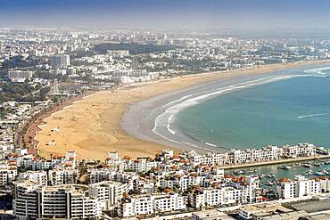 White modern architecture surrounding amazingly wide sandy beach in Agadir, Morocco, North Africa, Africa