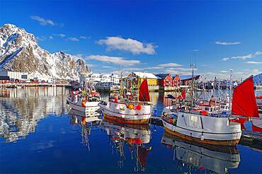 Fishing boats in harbour, snowy mountains, Svolvaer, Lofoten, Nordland, Norway, Europe