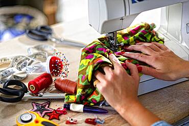 Dressmaker at the sewing machine, Germany, Europe