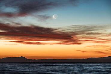 Moon at sunset at Lake Taupo, Waikato, North Island, New Zealand, Oceania