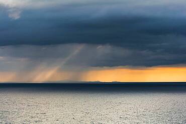 Rain clouds at sunset, Fletcher Bay, Coromandel, North Island, New Zealand, Oceania